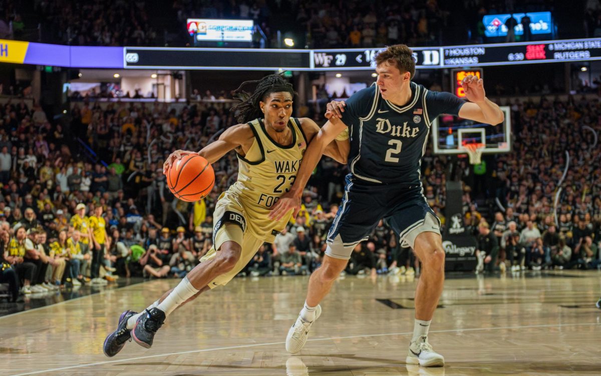 Hunter Sallis (23) attempts to drive the ball on Duke’s Cooper Flagg (2) in a matchup earlier this year. Flagg, a National Player of the Year candidate, has Duke as an expected top seed in March.