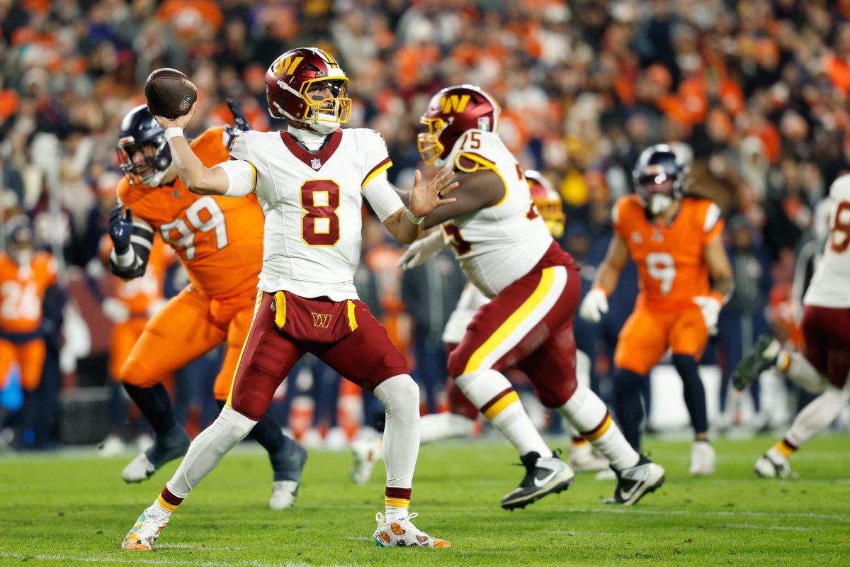 Washington Commanders quarterback Marcus Mariota (8) passes the ball against the Denver Broncos in the first quarter of the game at Northwest Stadium on November 30, 2025. (Geoff Burke-Imagn Images) 
