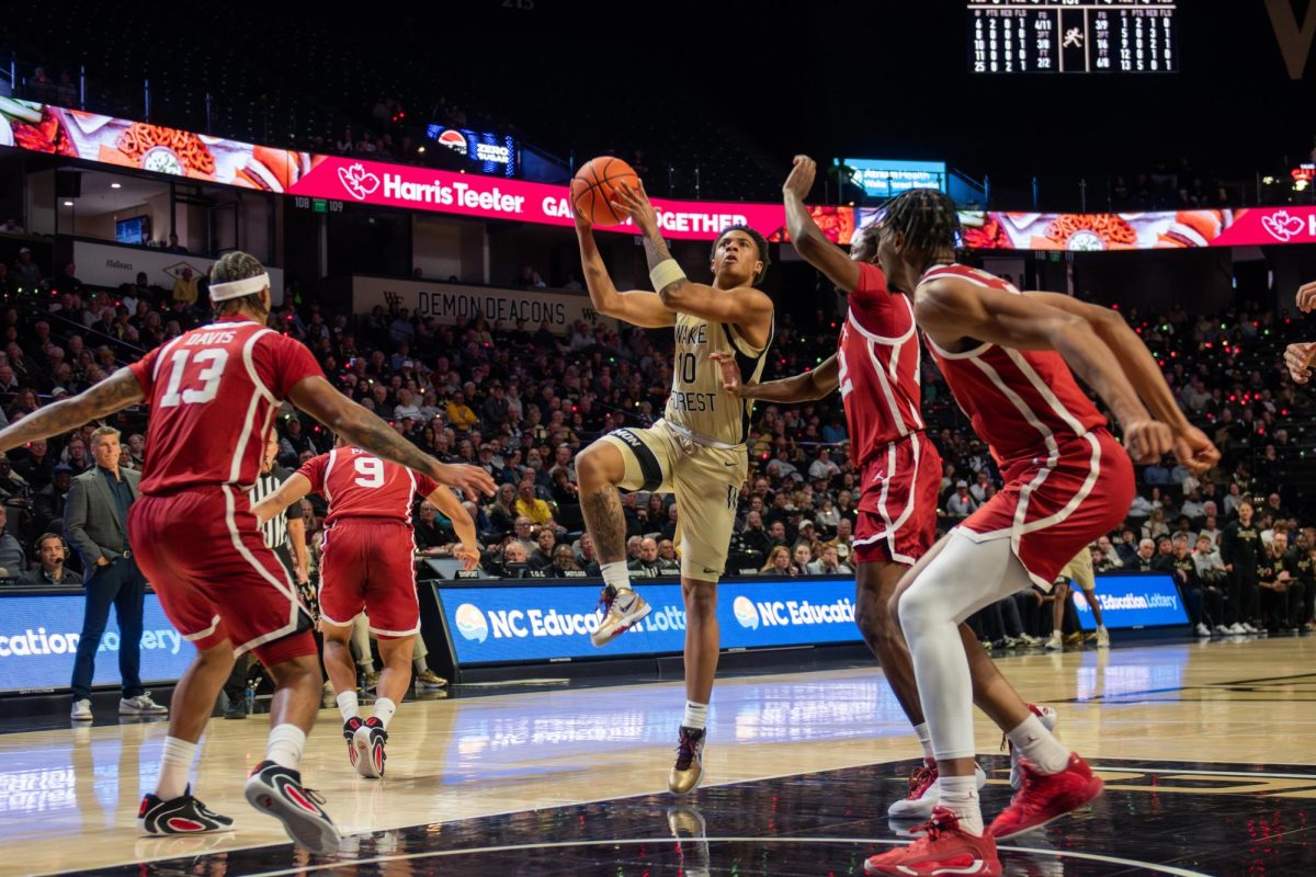 Sebastian Akins (10) drives hard to the basket, weaving through defenders during the ACC/SEC challenge matchup on Tuesday, Dec. 2. 