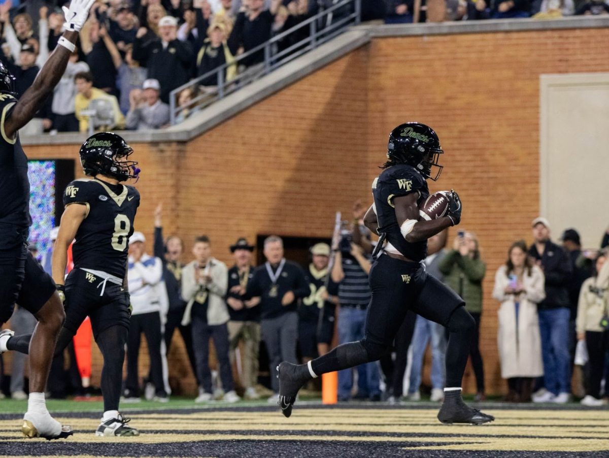 Demond Claiborne (1) trots in the endzone for his ninth touchdown of the season. The senior running back finished with 98 yards as he led the offense to 28 points. Behind him, Carlos Hernandez (8) looks on. Hernandez had a career game on Sunday with two touchdowns and 151 total yards. 