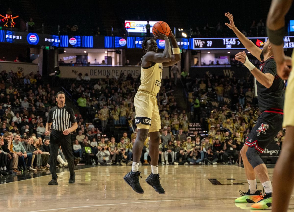 Omaha Biliew (0) pulls up for a three-point shot.