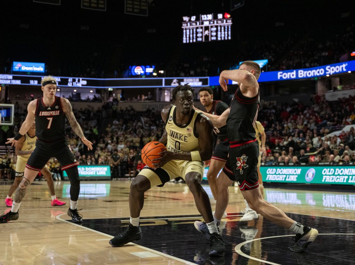 Omaha Biliew (0) gets low in the paint and attacks the rim.