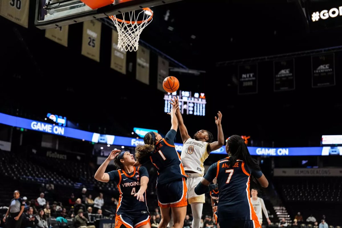 Freshman guard Milan Brown goes up for the rebound in traffic. Brown went on to score 30 in a career performance. (Courtesy of Wake Forest Athletics)