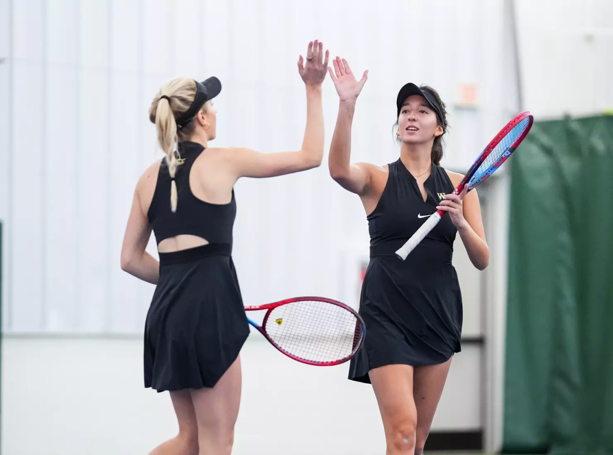 Kady Tannenbaum and Nevana Carton celebrate a point won in last weekend’s tournament against Marshall and UNC Greensboro. (Photo courtesy of Wake Forest Athletics)
