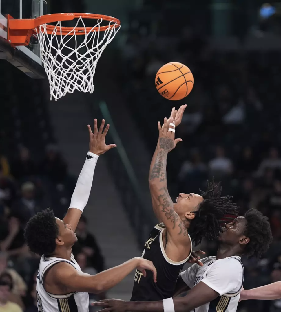 Forward Juke Harris (2) goes up for a tough layup amongst a sea of Yellow Jackets on Feb. 11 at McCamish Pavilion. (Courtesy of Wake Forest Athletics)