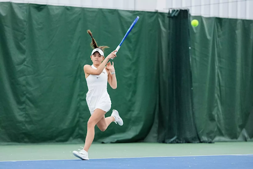 Wake Forest’s Evie Oxford follows through on a forehand in her singles match against William & Mary. (Photo courtesy of Wake Forest Athletics)