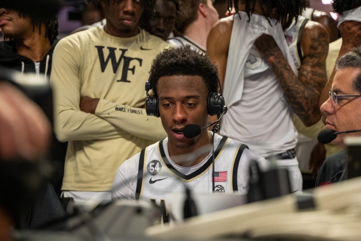 Myles Colvin (6) talks through his performance in an interview after the game. Colvin was electric for the Deacs on Saturday night, dropping 32 points on 9-12 FG shooting and 7-8 on threes.