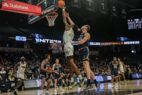 Tre’Von Spillers finishes at the rim as a part of his 14-point performance against Navy on Wednesday night. 