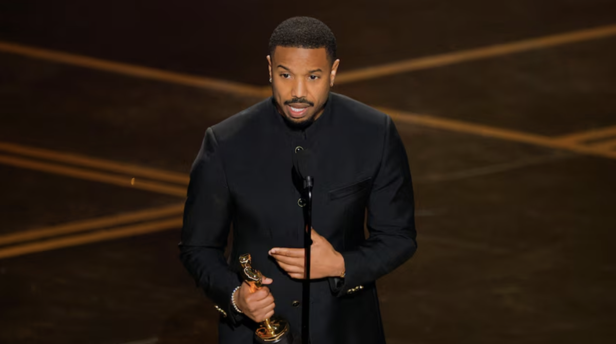 Michael B. Jordan accepts the Academy Award for Best Actor for his dual role in “Sinners.” 
