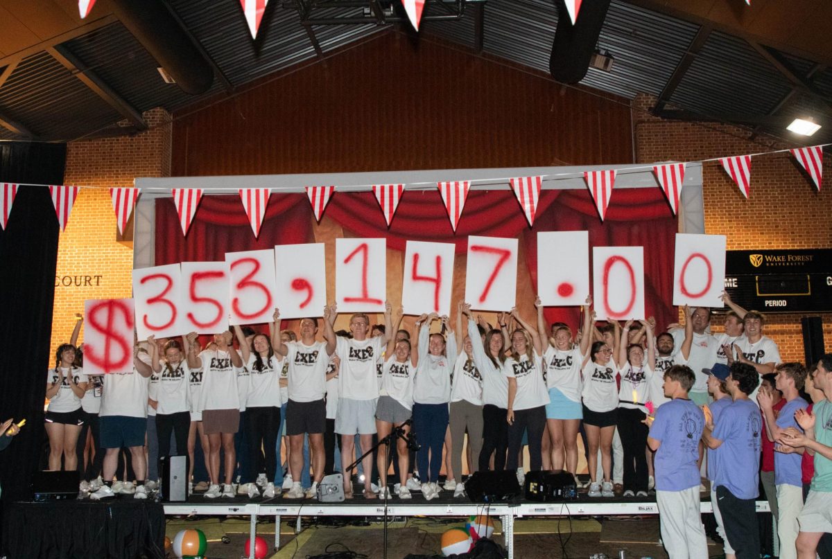 The Wake 'N Shake Executive Members held up their final amount raised of  $353,147 to support cancer research. 