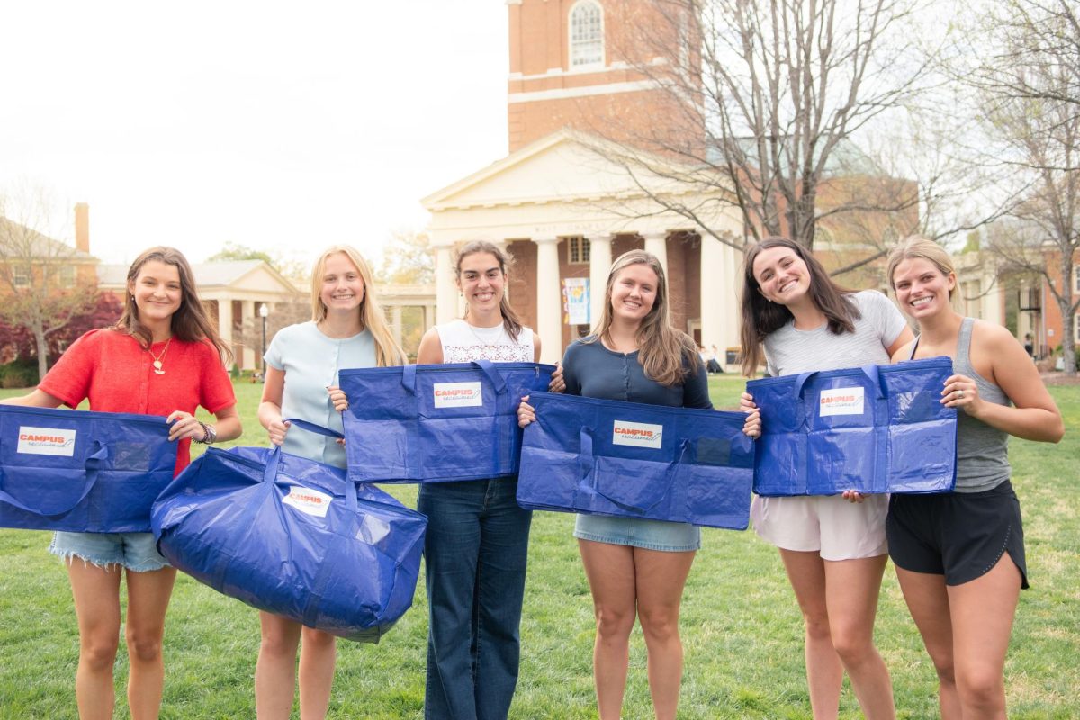 Anna Anstey (second from left) and her Campus Reclaimed team posing with Reclaim Totes