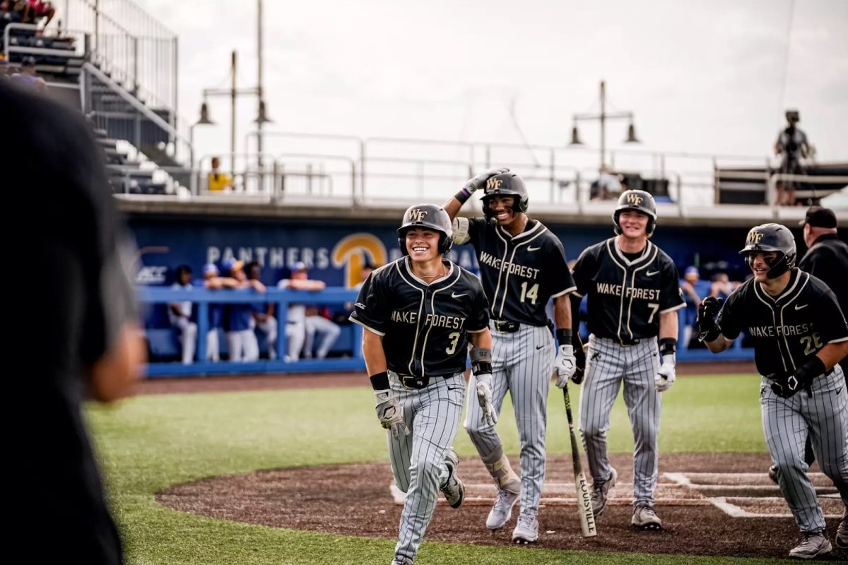 Freshman shortstop JD Stein (3) rushes towards the Wake Forest dugout in celebration. (Courtesy of Wake Forest Athletics)