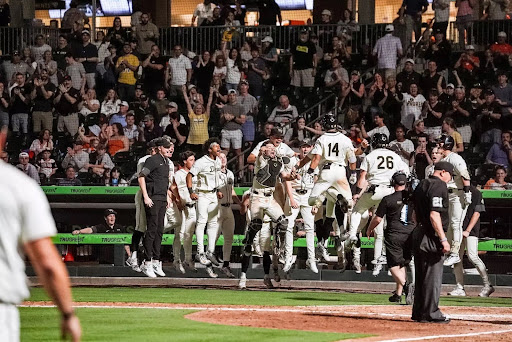 Javar Williams (14) jumps for joy after smacking a 7th inning grand slam. (Courtesy of Wake Forest Athletics)